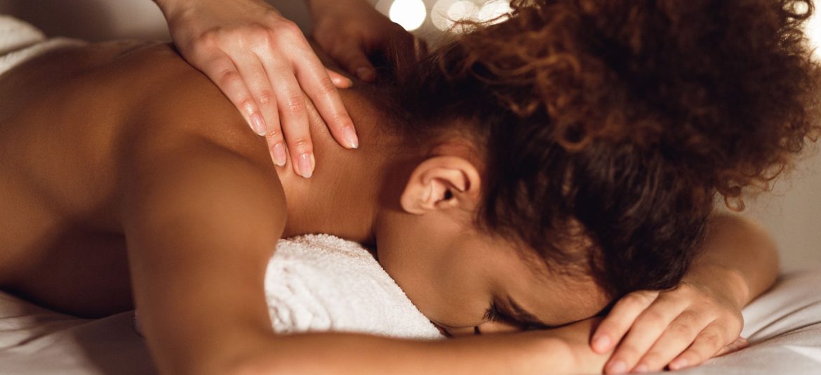 woman-enjoying-therapeutic-neck-massage-in-spa-GMDE84J.jpg